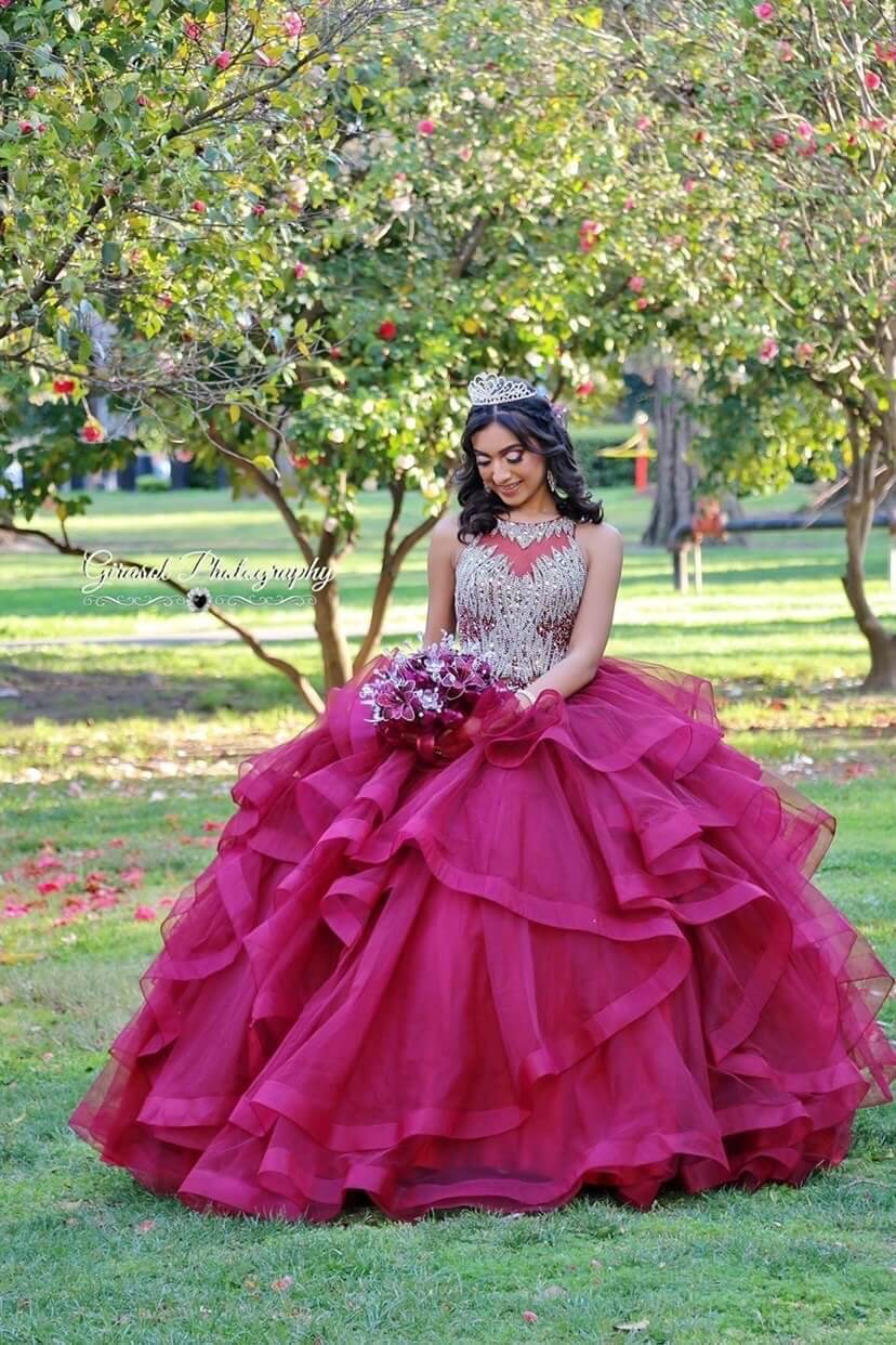 Model wearing a red dress on the grass
