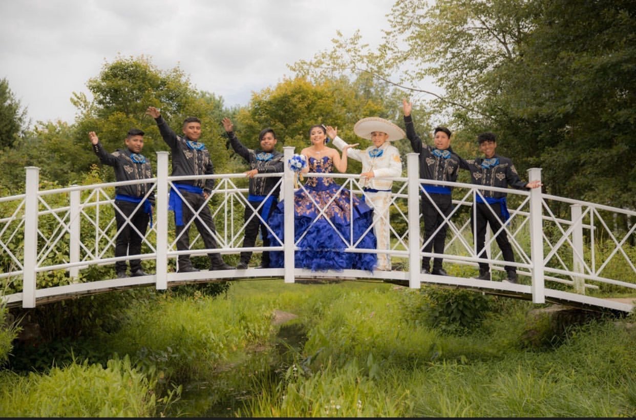 Model wearing a blue dresses
