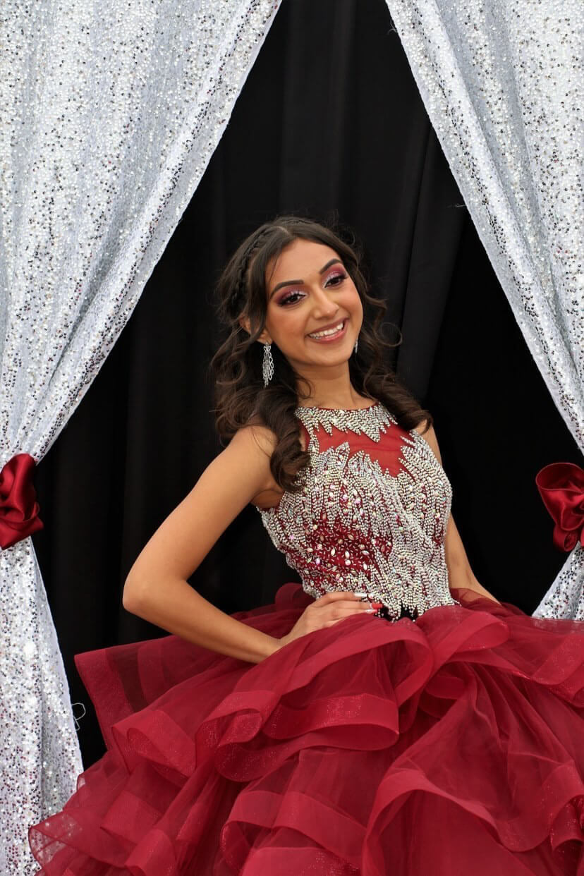Model wearing a red-white gown