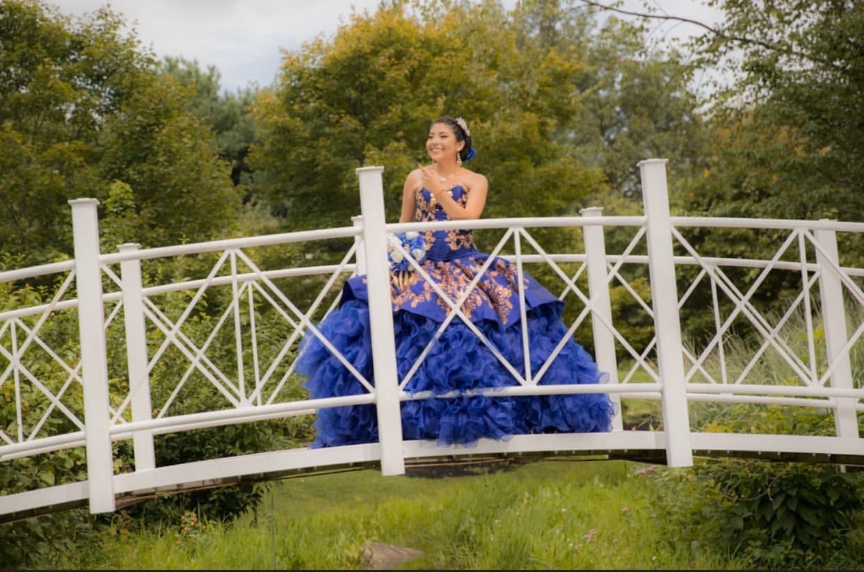 Model wearing a blue dress